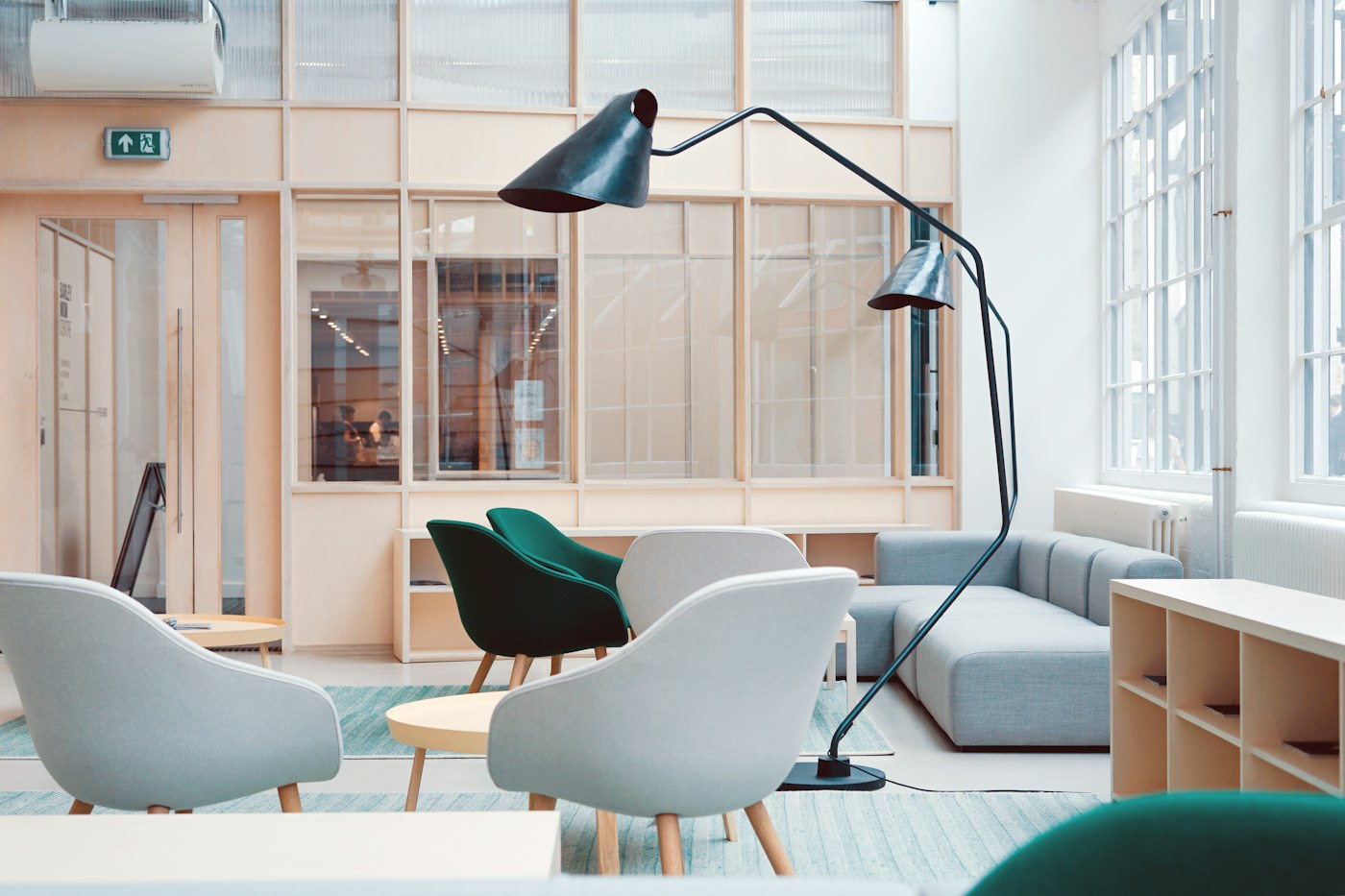 A bright apartment-style room with chairs and open wall space