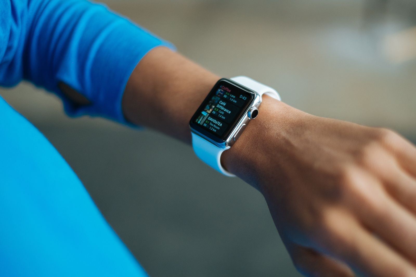 A smartwatch worn on a wrist outdoors